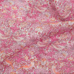 Close-up of pink floral and bird patterned fabric