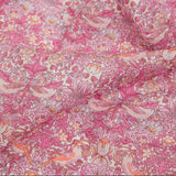 Close-up of pink floral and bird patterned fabric